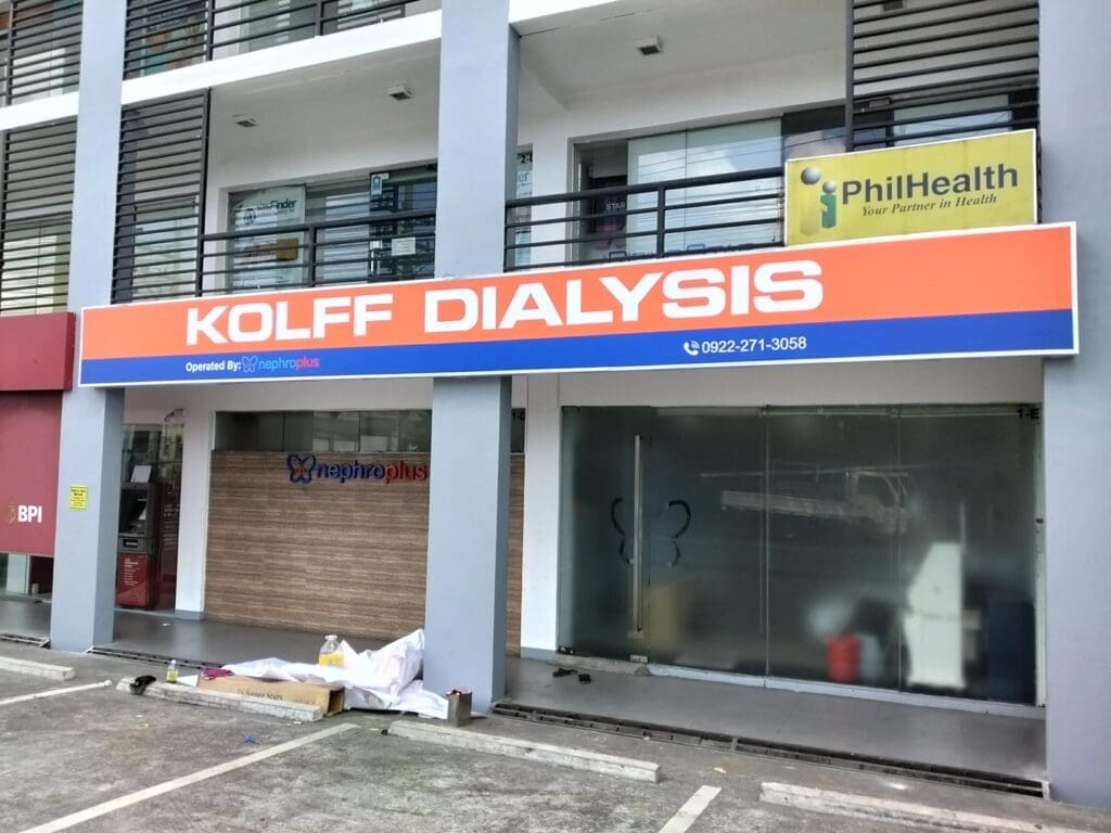 Outdoor acrylic building signage for KOLFF DIALYSIS, PhilHealth sign, glass windows, Metro Manila. Sign maker Philippines by M&G Global Ads.