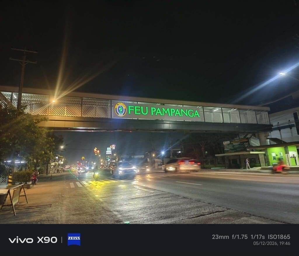Outdoor acrylic signage with green FEU PAMPANGA letters on pedestrian overpass, Pampanga, sign maker Philippines by M&G Global Ads.