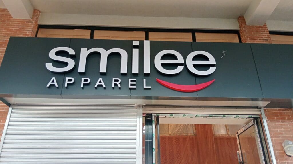 Outdoor acrylic storefront signage for smilee APPAREL, Metro Manila, sign maker Philippines by M&G Global Ads.