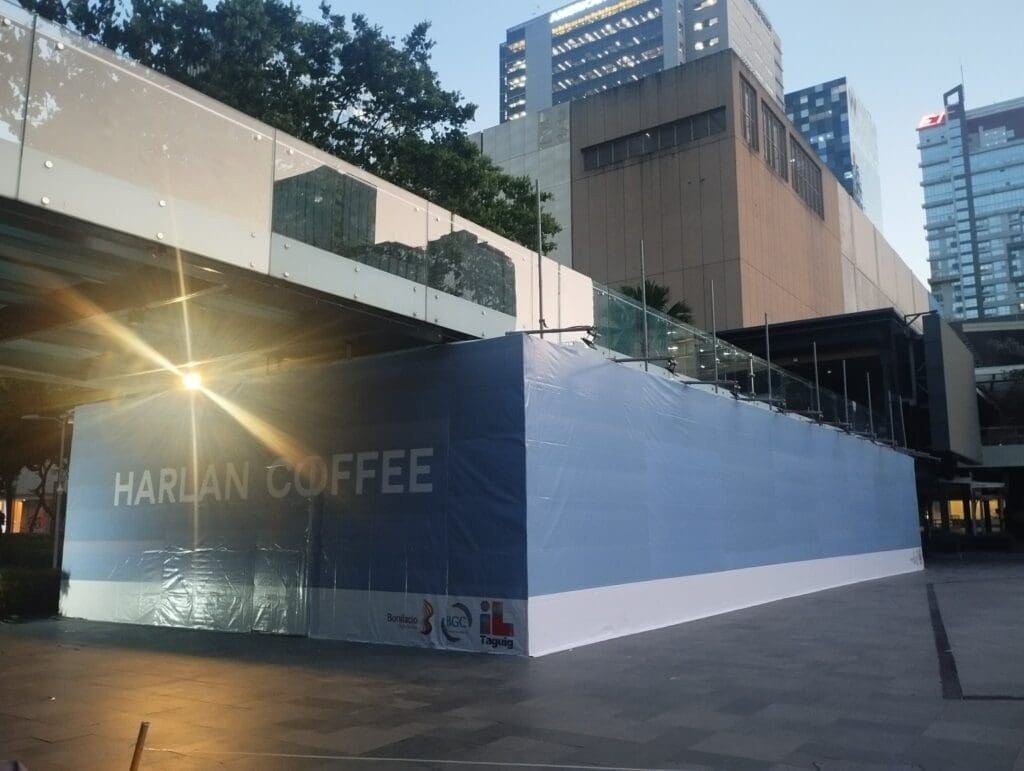 Outdoor building sign for HARLAN COFFEE, partially covered, in Metro Manila by sign maker Philippines M&G Global Ads.