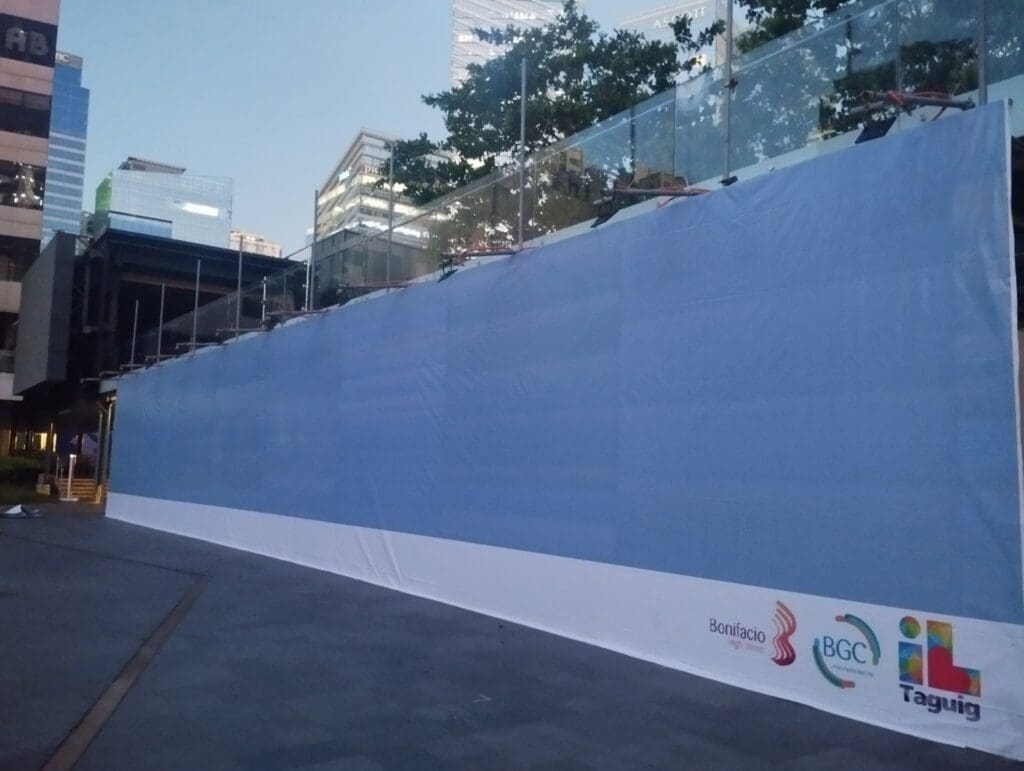 Outdoor building signage tarp for Bonifacio, BGC, and Taguig at a construction site in Metro Manila by sign maker Philippines by M&G Global Ads.
