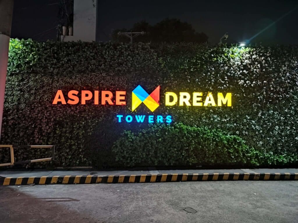 Outdoor LED acrylic signage for ASPIRE DREAM TOWERS with colorful logo, Metro Manila. Sign maker Philippines by M&G Global Ads.