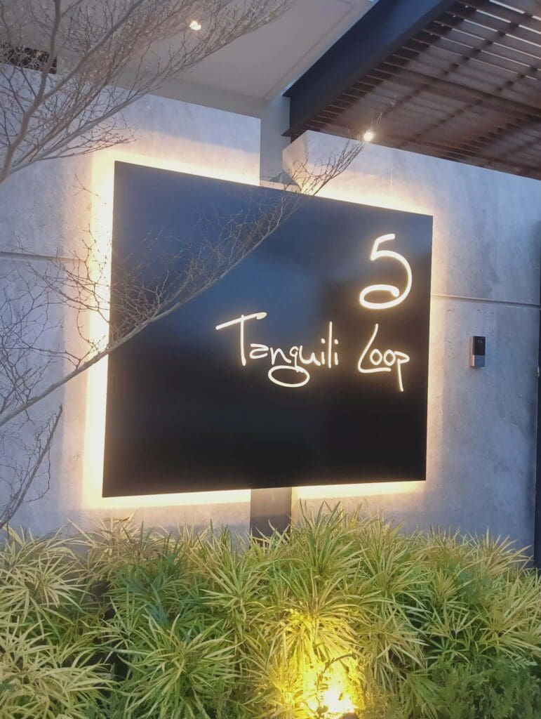 Outdoor LED building sign, acrylic letters "5 Tanguli Loop" on concrete wall, Metro Manila. Sign maker Philippines by M&G Global Ads.