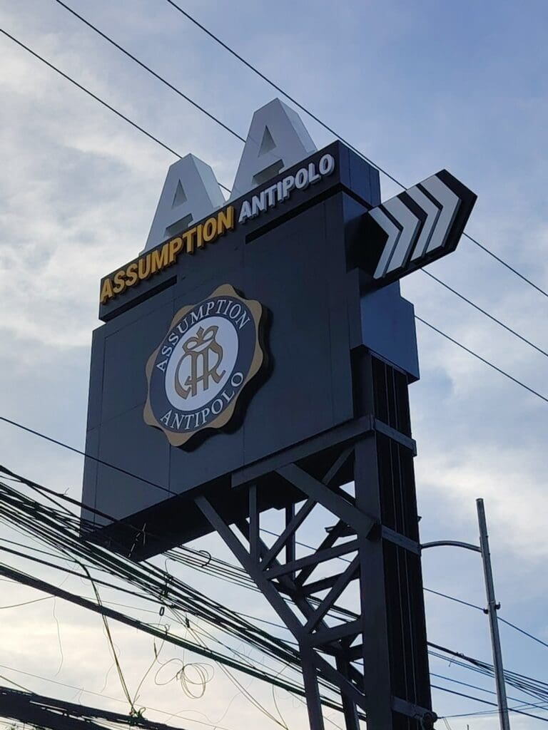 Outdoor signpost signage for Assumption Antipolo, directional wayfinding, Metro Manila, sign maker Philippines by M&G Global Ads.