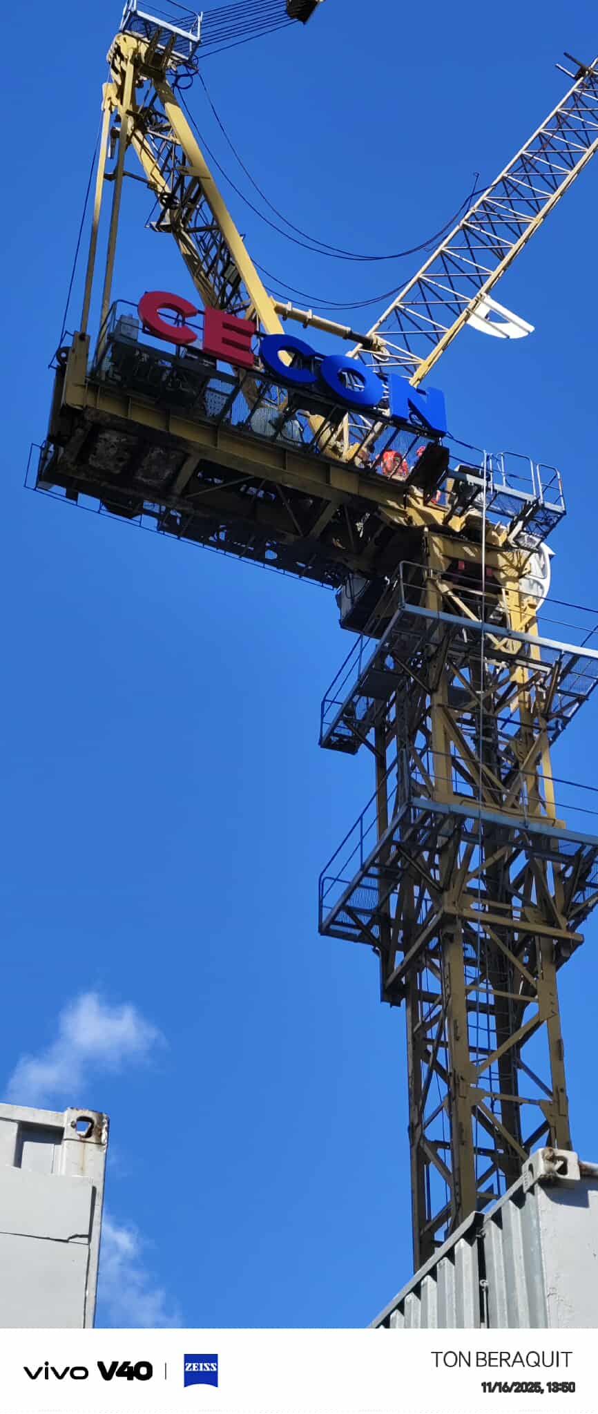 Outdoor tower crane signage for GEOSA on a yellow crane, blue sky background, Metro Manila, sign maker Philippines by M&G Global Ads.