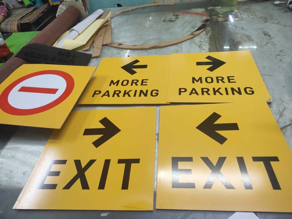 Parking and wayfinding acrylic signs, indoor use, yellow with arrows, Metro Manila sign maker Philippines by M&G Global Ads.