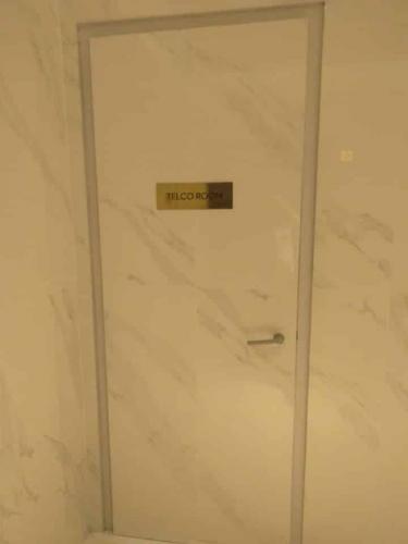 brass signage | telco room