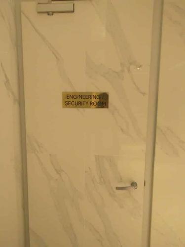 brass signage | security room