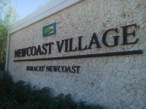 new coast village - acylic sign - signage philippines
