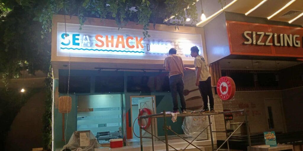 Sign maker Philippines installing LED building signage for SEA SHACK restaurant, Metro Manila, by M&G Global Ads.