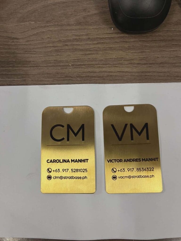 Stainless steel engraved name tags for Carolina Manhit and Victor Andres Manhit, Metro Manila sign maker Philippines by M&G Global Ads.