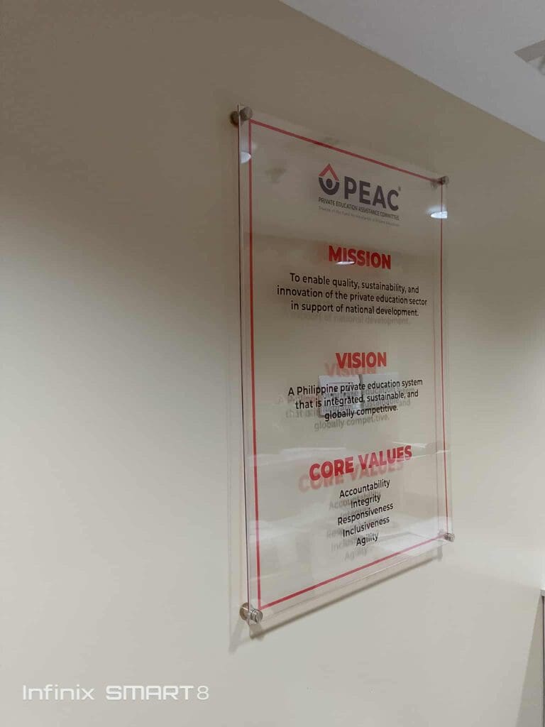 Wall-mounted clear acrylic indoor signage for PEAC, Metro Manila, sign maker Philippines by M&G Global Ads.