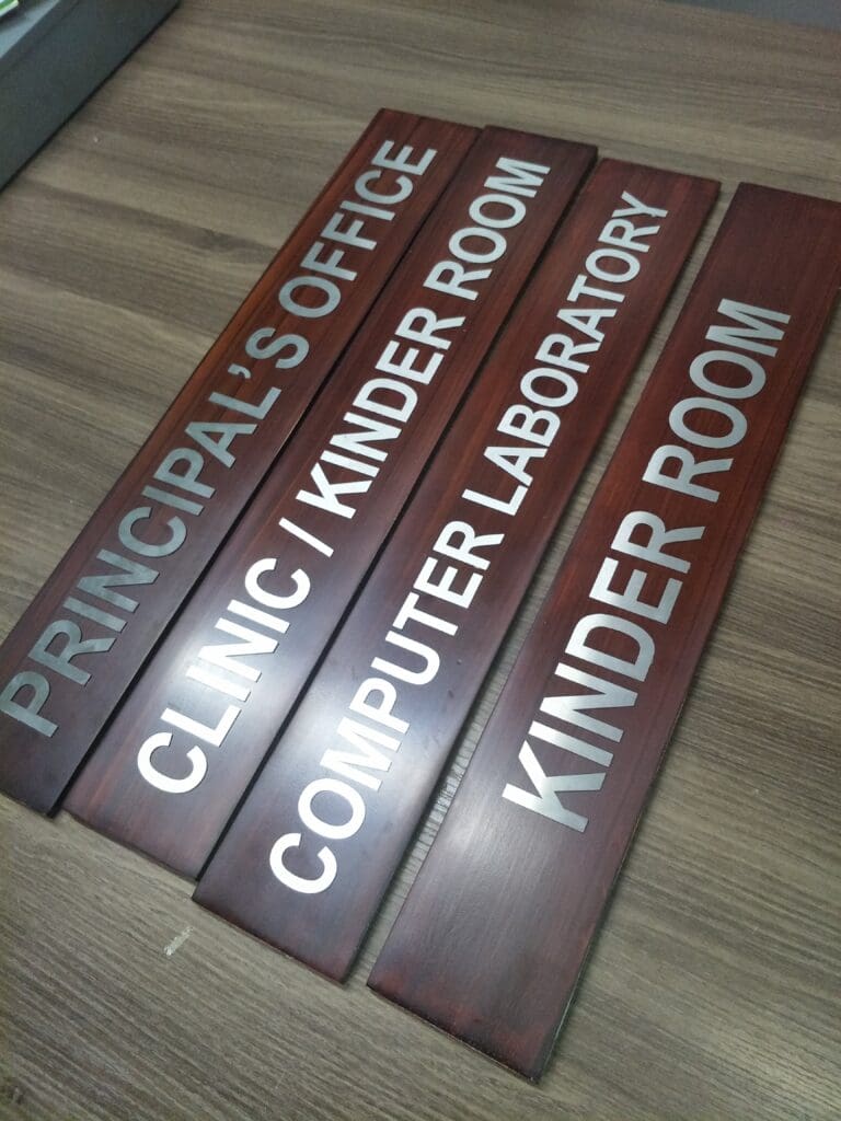 Wooden indoor room signs with engraved silver text for school in the Philippines by sign maker Philippines, M&G Global Ads.
